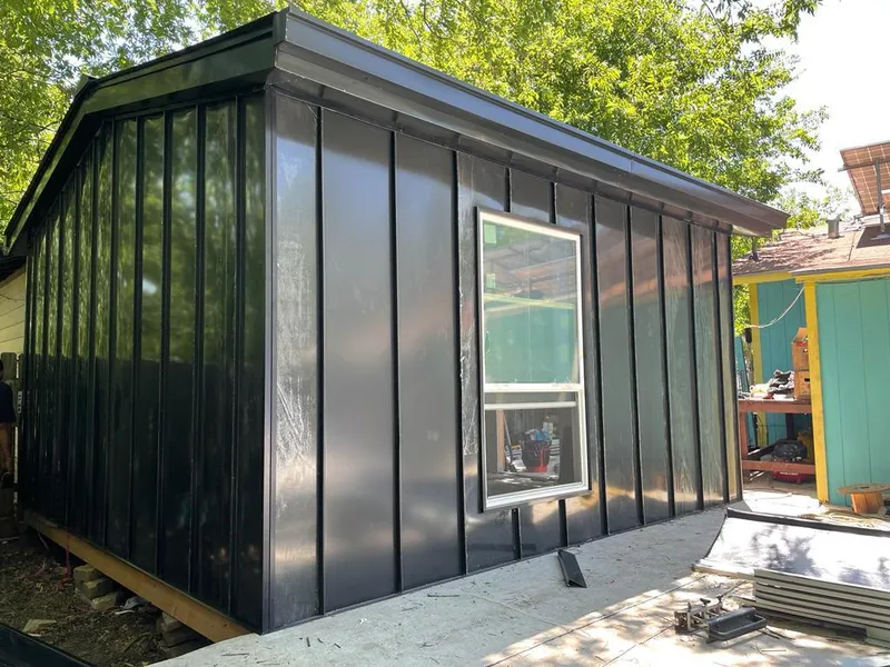 Black standing seam metal wall panels for Metal Roof Installation in Sanibel