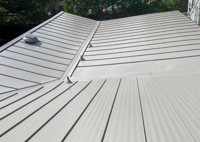 Solar attic fan installed on a metal roof for Roof Ventilation in Sanibel